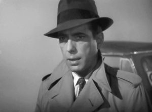 Humphrey Bogart in Casablanca trailer. Credit: By Published by United Artists. Photographer uncredited and unknown. - Scan via Heritage Auctions Lot #54145. Cropped and retouched by uploader; see unretouched image in upload history below., Public Domain, https://commons.wikimedia.org/w/index.php?curid=93004324